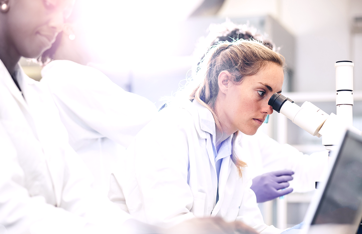 scientist with microscope