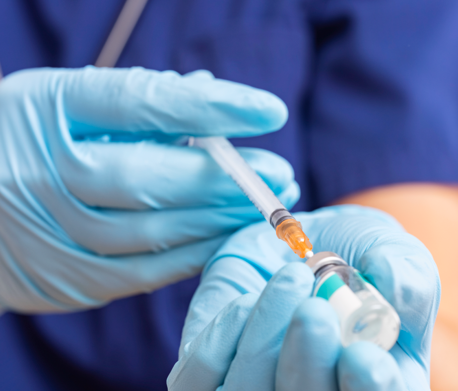 A doctor using an injection in an hospital